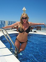 Kelly gives a blowjob by the pool in Santorini.